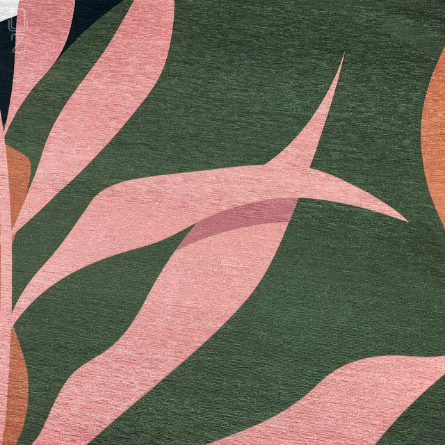 Zoomed-in view of green, pink and orange leaf themed printed pillow cover.